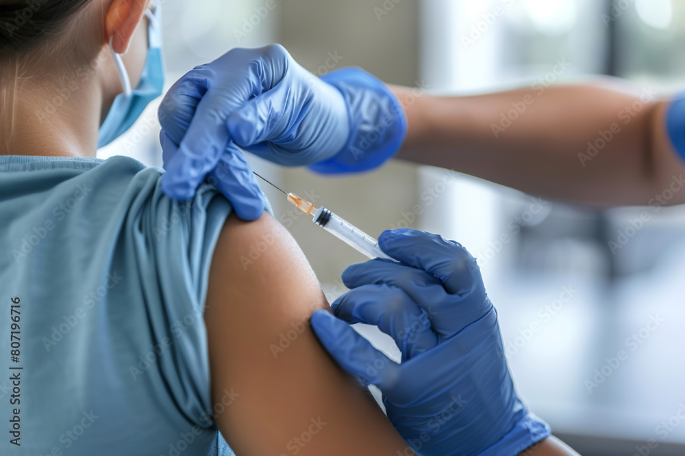 Child receiving a vaccination. Little boy in face mask in doctor's office is vaccinated. Kid giving injection shot. Syringe with covid-19, coronavirus, flu vaccine. Dangerous infectious disease, MPOX Child receiving a vaccination. Little boy in face mask in doctor's office is vaccinated. Kid giving injection shot. Syringe with covid-19, coronavirus, flu vaccine. Dangerous infectious disease, MPOX