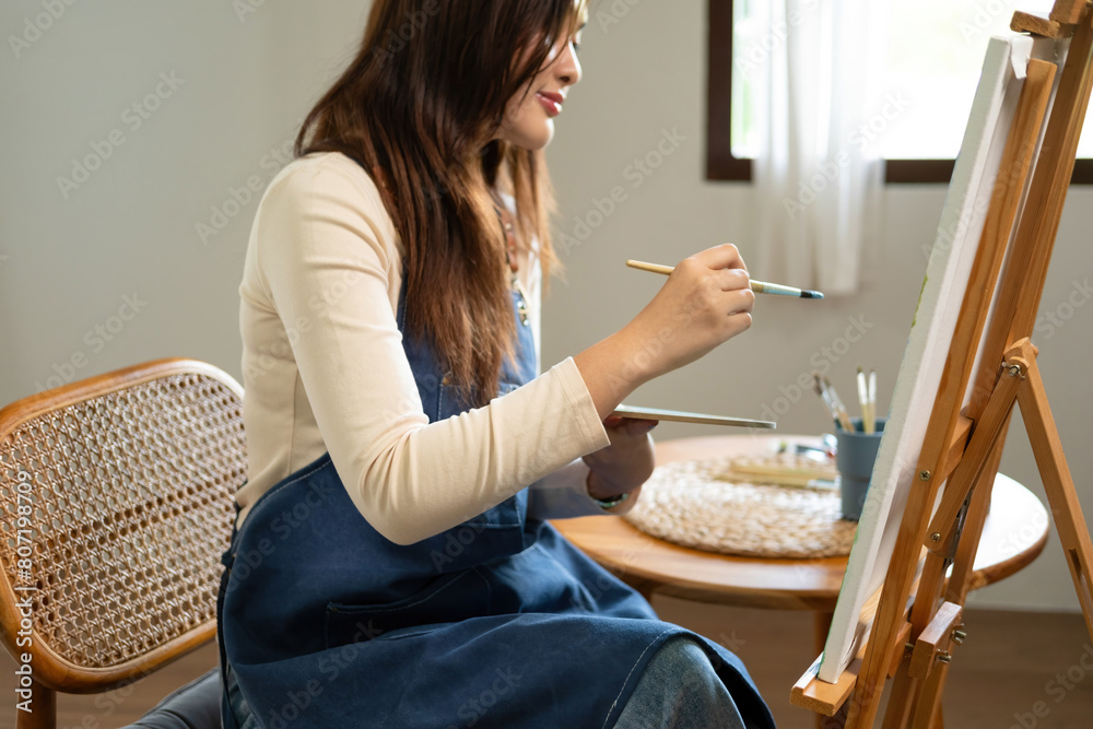 The creative person stood in his studio, lost in concentration as he worked on his latest painting. The creative person stood in his studio, lost in concentration as he worked on his latest painting.
