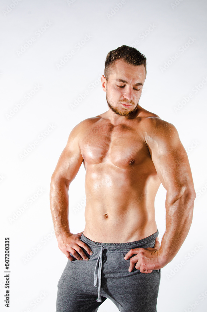 Handsome man with an athletic body. Fitness and healthy lifestyle. Handsome man with an athletic body. Fitness and healthy lifestyle.