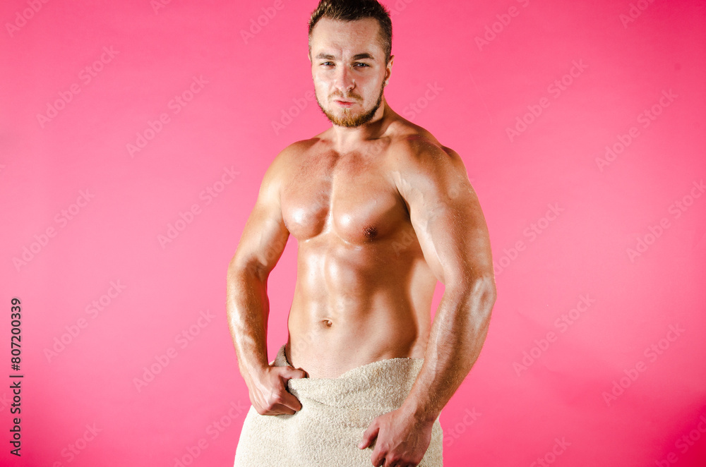 Fototapeta premium Handsome man with an athletic body. Fitness and healthy lifestyle.