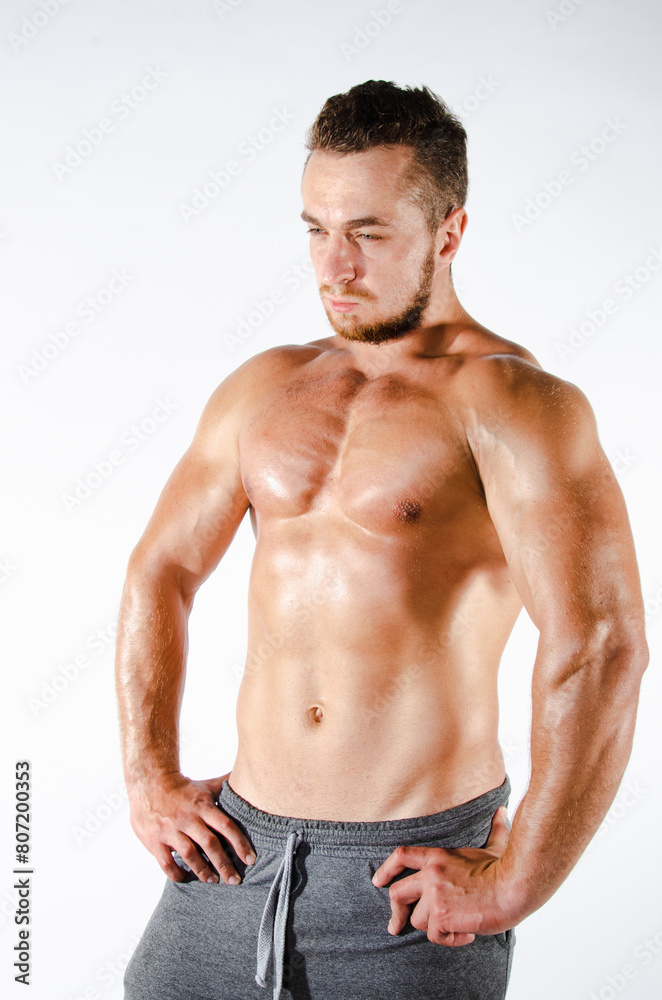Handsome man with an athletic body. Fitness and healthy lifestyle. Handsome man with an athletic body. Fitness and healthy lifestyle.