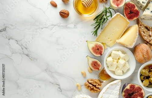 Cheese figs nuts and honey on marble with copy space Top view banner