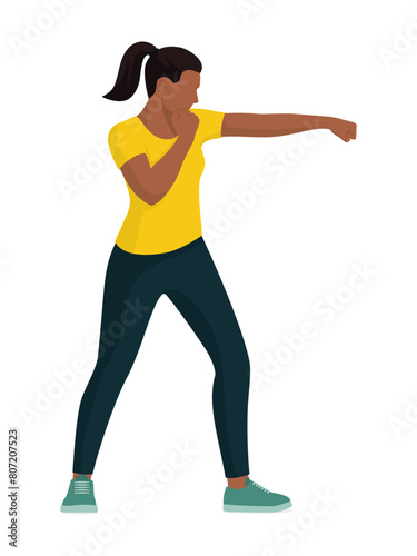 Confident strong woman giving a punch