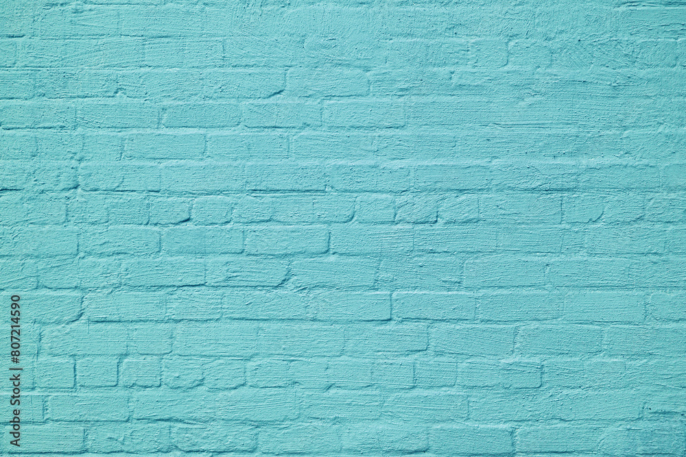 Obraz premium The brick wall is painted with blue paint. Abstract construction background.