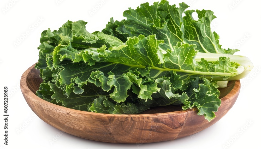 Isolated wooden plate with Mustard Greens vegetable also known as Bog Choy on white background with clipping path Isolated wooden plate with Mustard Greens vegetable also known as Bog Choy on white background with clipping path