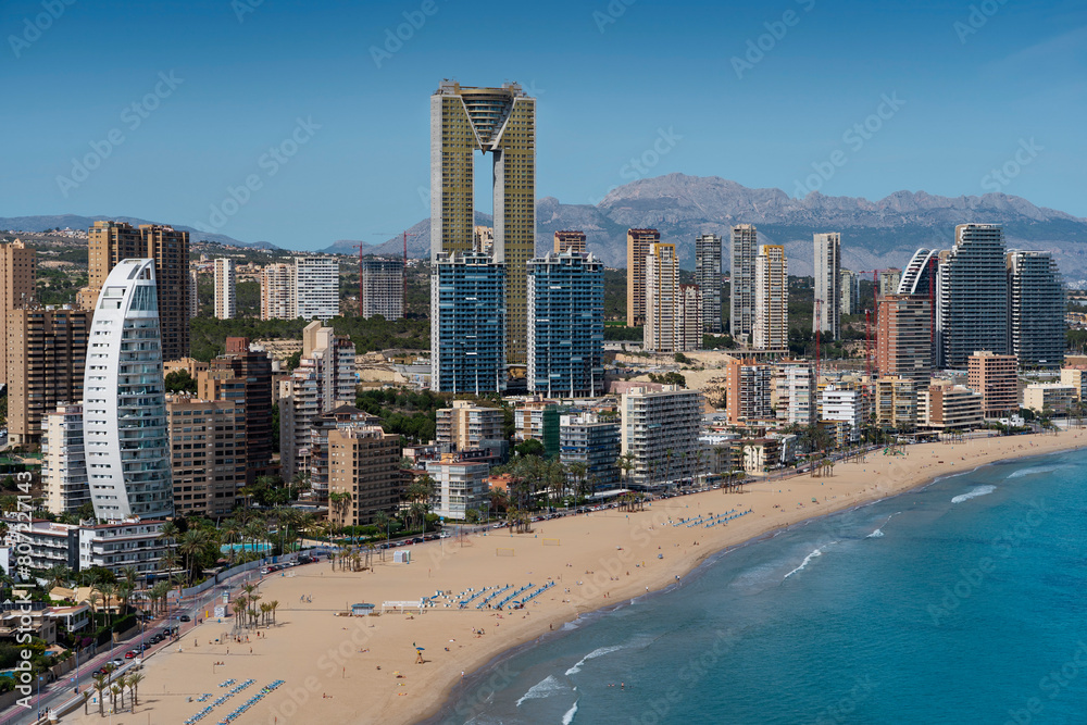 Benidorm skyline view, West Beach Promenade (Playa de Poniente) and mountains of Alicante region enveloping the city