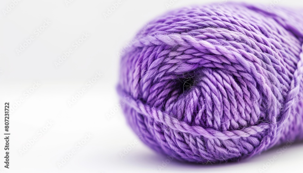 Purple wool for knitting made from sheep s wool is heavy and thick perfect for hand knitting with two needles It comes in a skein and is isolated in a white co Purple wool for knitting made from sheep s wool is heavy and thick perfect for hand knitting with two needles It comes in a skein and is isolated in a white co