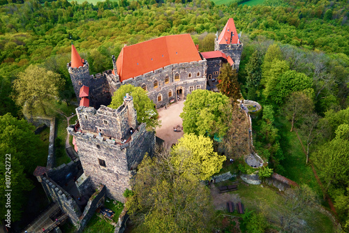 Fototapeta Naklejka Na Ścianę i Meble -  Grodziec Castle surrounded by green forest, aerial view. Old historical fortress. Famous touristic place in Lower Silesia, Poland