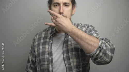 Angry young male whistling with fingers