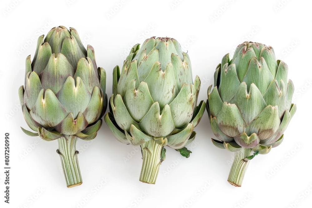 Obraz premium Three artichokes isolated on a white background