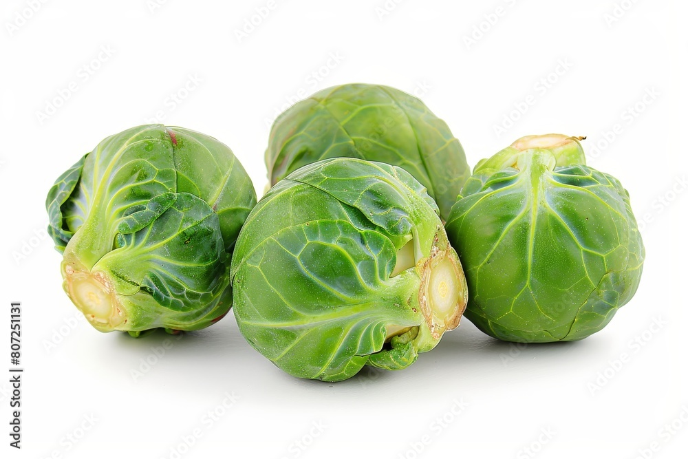 Three isolated brussels sprouts on white background