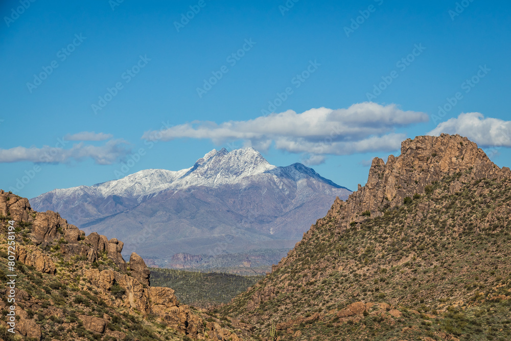The 4 peaks mountain outside of Phoenix covered in snow and framed by a valley in the foreground The 4 peaks mountain outside of Phoenix covered in snow and framed by a valley in the foreground