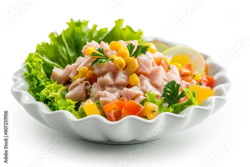 Tuna salad with corn on white plate on white background