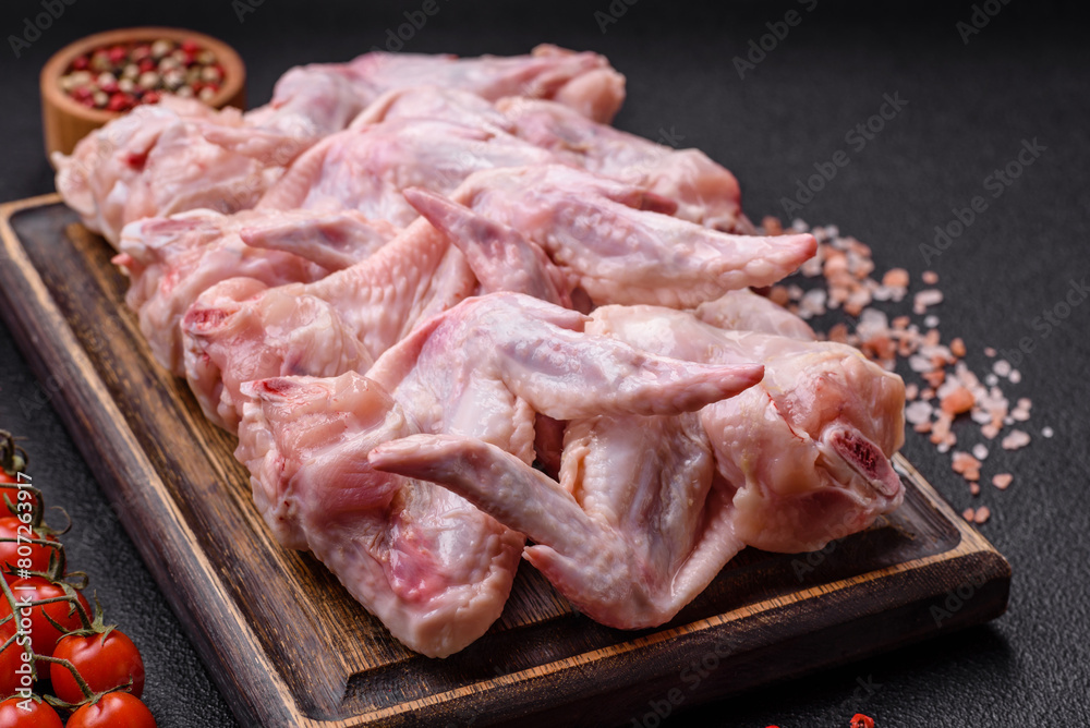 Fresh chicken wings with salt, spices and herbs