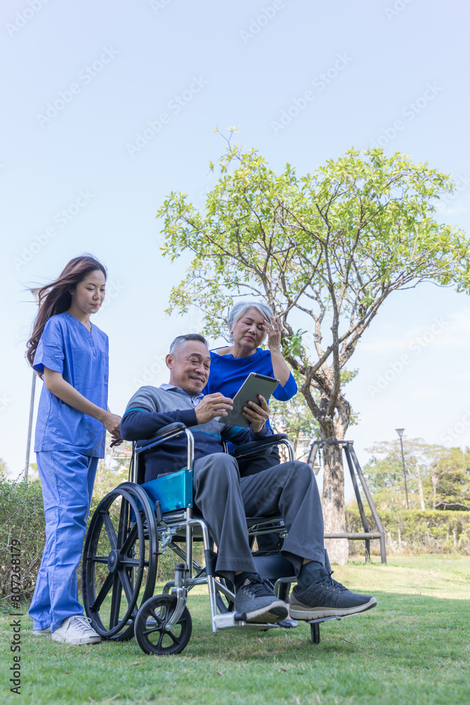 Doctor or Caregiver nurse take care a Senior patient sit on wheelchair. Doctor or Nurse helping senior Man Doctor or Caregiver nurse take care a Senior patient sit on wheelchair. Doctor or Nurse helping senior Man