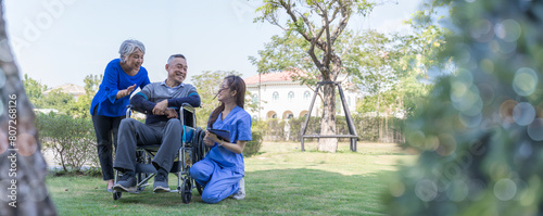 Photography Doctor or Caregiver nurse take care a Senior patient sit on wheelchair