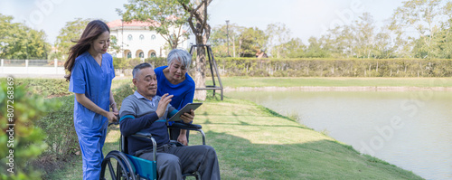 Doctor or Caregiver nurse take care a Senior patient sit on wheelchair. Doctor or Nurse helping senior Man