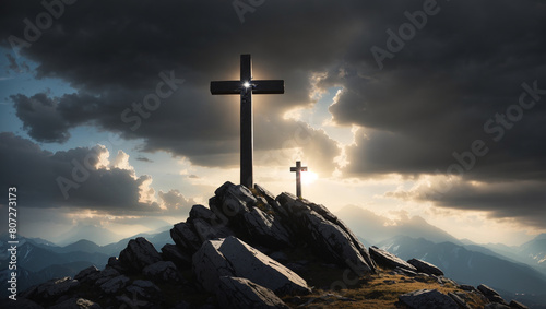 A wooden cross on top of a rocky hill. photo