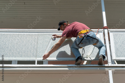 worker, tape, taping, paint, at height, house, ropes, belt, insurance, climber, painter, amateur, builder, man, contractor, improvement, industry, hazard, dangerous, industrial, wall, color, brush, hi