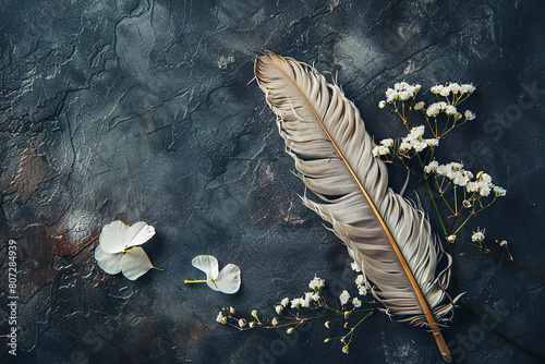 Elegant Feather and Flowers on Textured Background.Greeting card. Flat lay photo