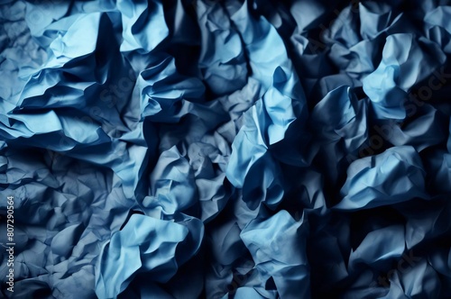 Blue crumpled paper texture used for paper background texture in decorative art work. Blue silk crumpled fabric as an abstract background. Wallpaper background