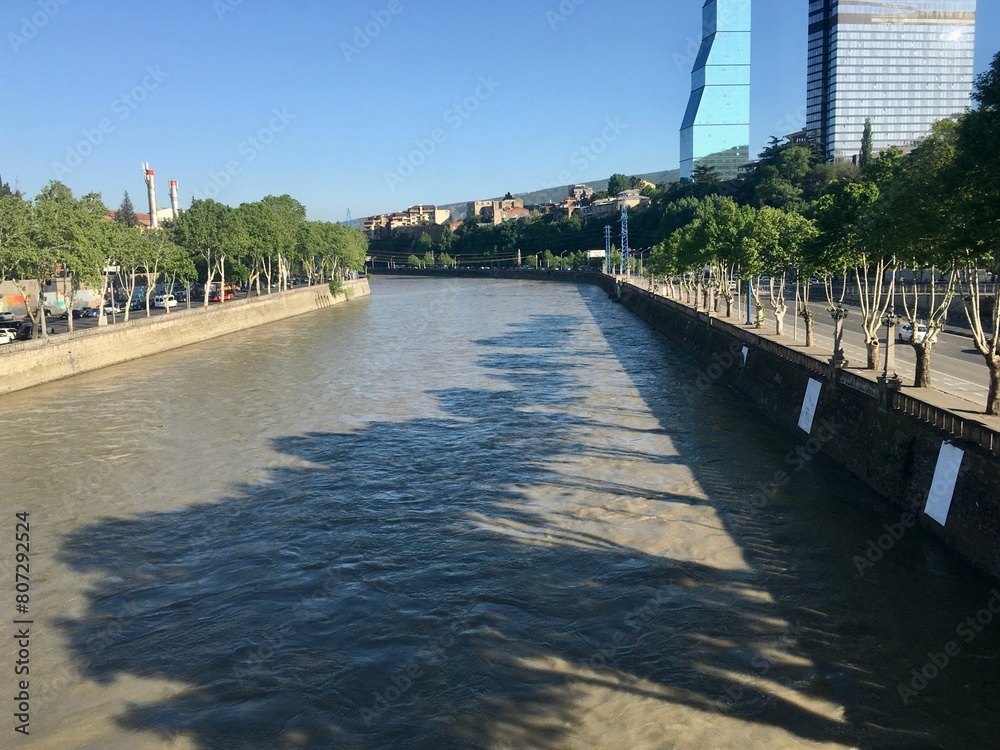 Mtkvari river and tree shadows on the surface of the water, Tbilisi, Georgia Mtkvari river and tree shadows on the surface of the water, Tbilisi, Georgia