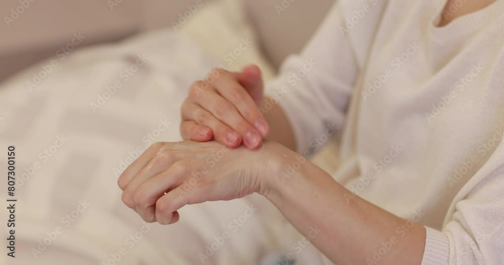 female hands use cream or lotion in the bedroom female hands use cream or lotion in the bedroom