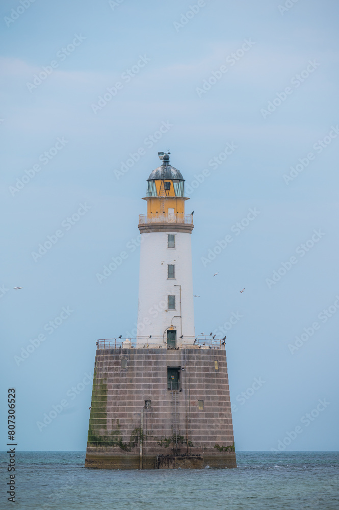 Beautiful Rattray Head Lighthouse, Scottish Highlands, Scotland.Travel landmarks .Seascape.Vertical banner