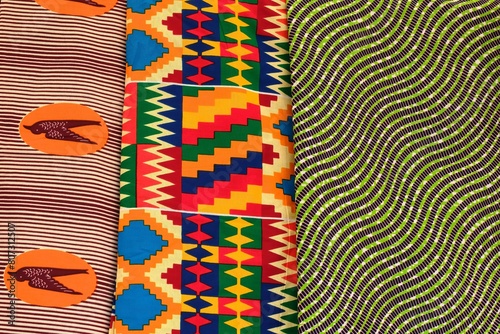 Close up view of bright multi colour and patterned traditional African Ghanaian cotton print cloths