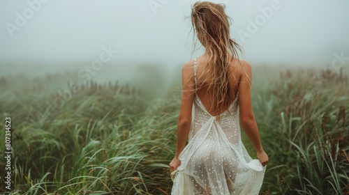 Woman in White Dress Walking Through Tall Grass