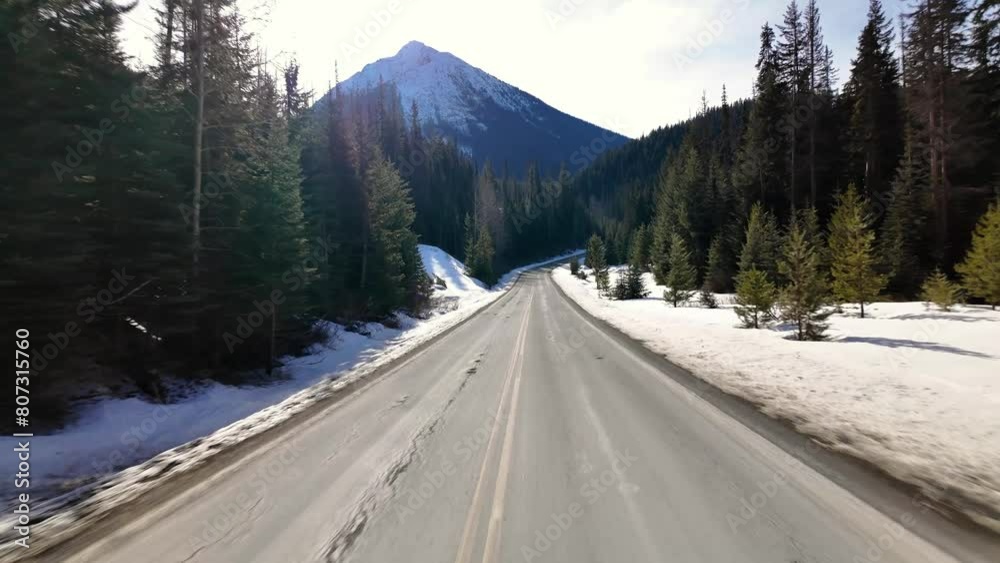 Scenic Highway surrounded by Mountains, Trees and Snow. Daytime, Duffy Lake Road. Near Pemberton and Lillooet, British Columbia, Canada.
