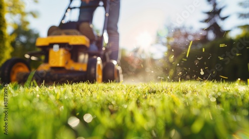 close-up of a man mowing the lawn