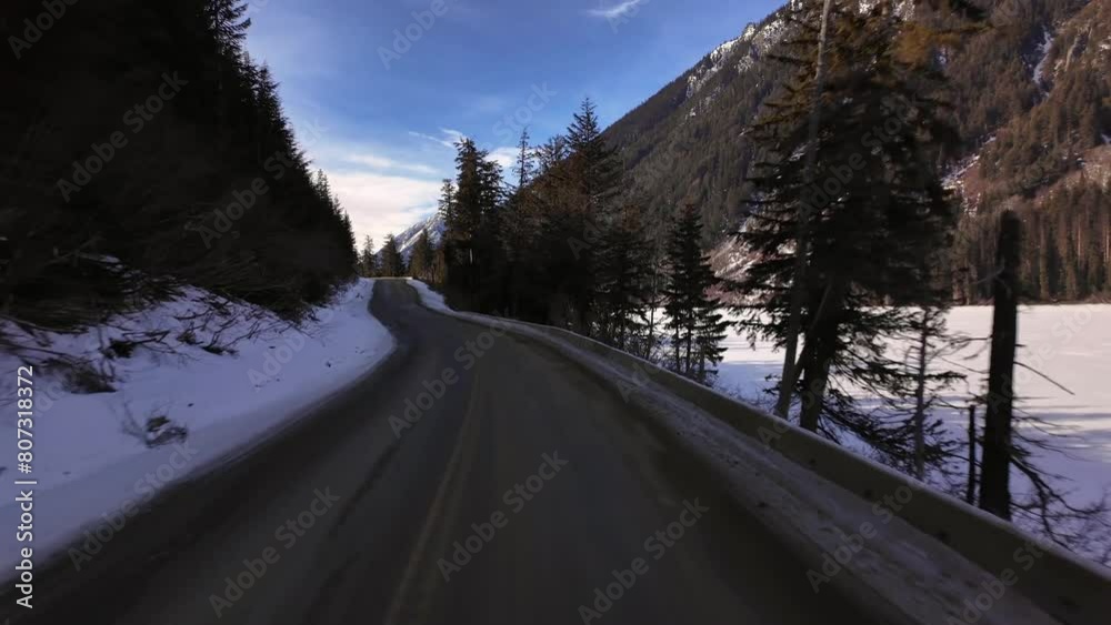 Scenic Highway surrounded by Mountains, Trees and Snow. Sunrise, Duffy Lake Road. Near Pemberton and Lillooet, British Columbia, Canada. Scenic Highway surrounded by Mountains, Trees and Snow. Sunrise, Duffy Lake Road. Near Pemberton and Lillooet, British Columbia, Canada.