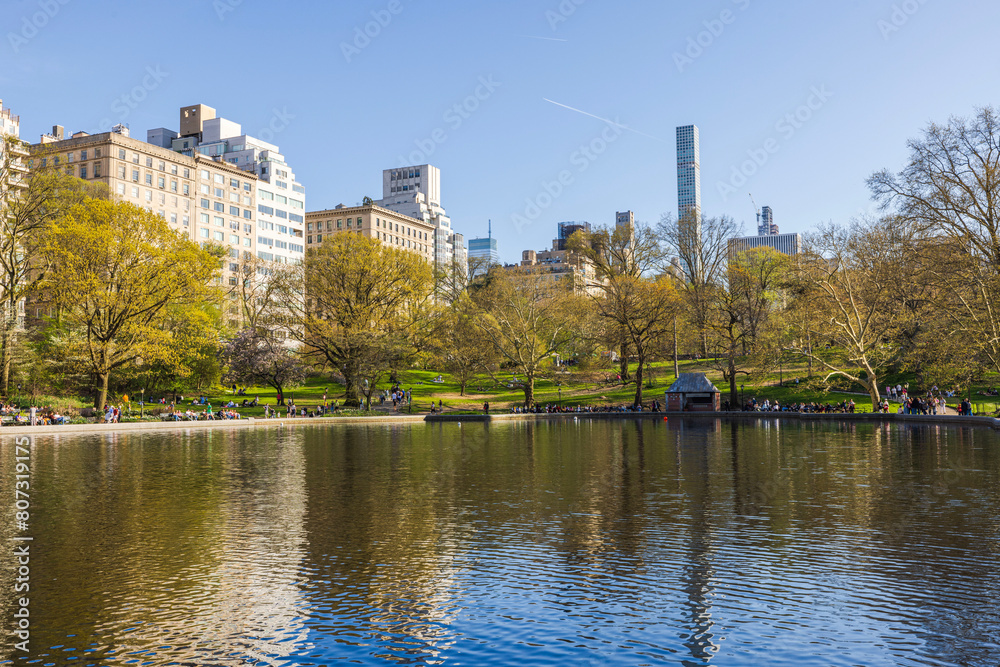 Beautiful view of the lake in Central Park New York City, with Manhattan skyscrapers in the background. USA.