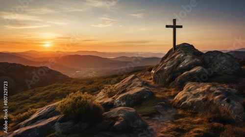 Scenic sunset over mountain landscape with cross