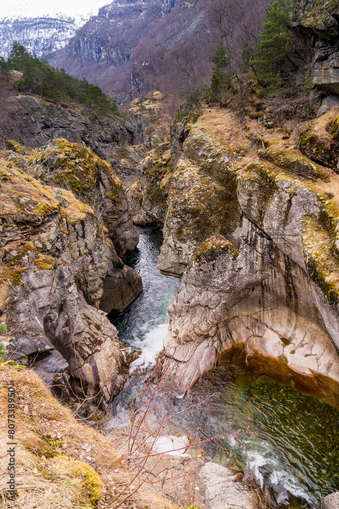 Sjurhaugfossen, A mountain range with a river running through it