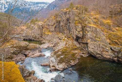Sjurhaugfossen, A mountain range with a river running through it