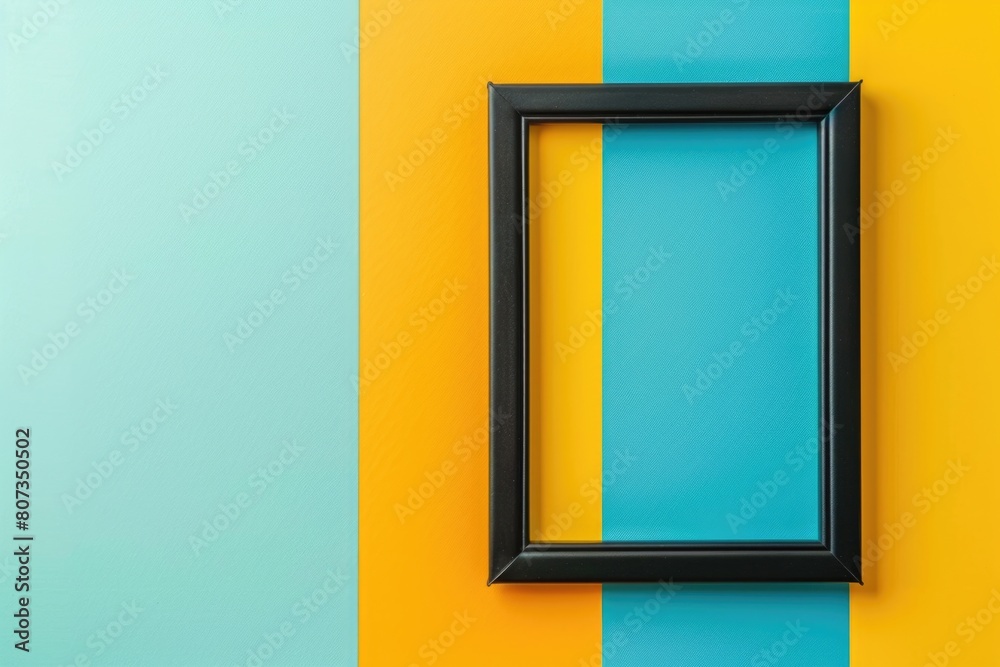 A black picture frame hanging on a vibrant yellow and blue wall. Perfect for interior design projects A black picture frame hanging on a vibrant yellow and blue wall. Perfect for interior design projects