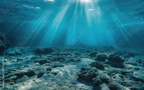 Sun rays penetrating deep, mysterious blue ocean waters.
