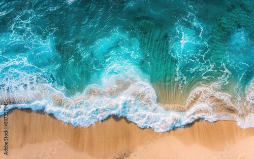 Vibrant aerial view of turquoise waters meeting golden sandy beach with gentle waves.