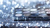 Glittering silver eyeshadow palette sparkling against a silver sequin backdrop
