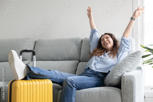 Woman posing happy ready to travel with suitcase
