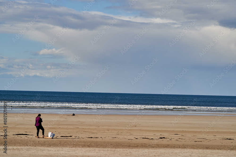 People running playing relaxing on the beach