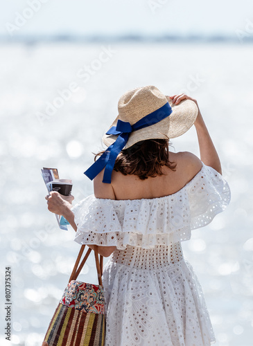 woman looking out on the beach