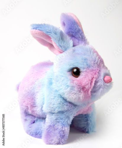 Soft fluffy rabbit toy with long ears, isolated on a white background