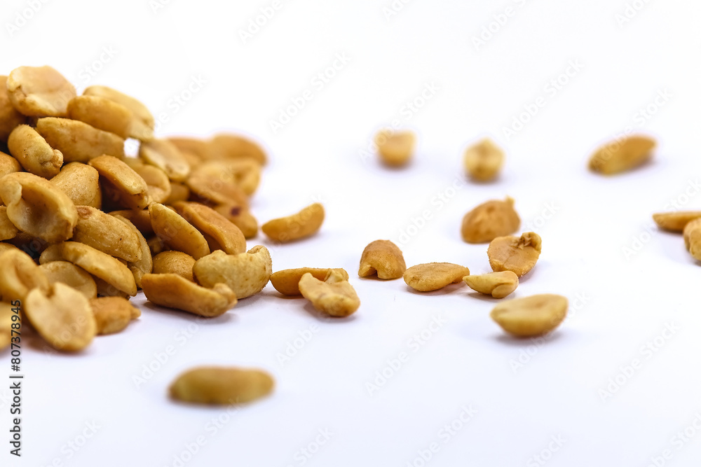 roasted salted peanuts photographed close-up on a white background roasted salted peanuts photographed close-up on a white background