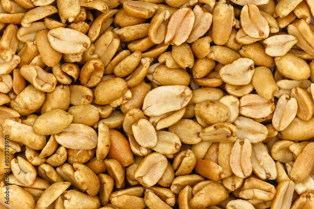 roasted salted peanuts photographed close-up on a white background roasted salted peanuts photographed close-up on a white background