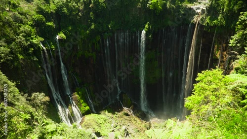 waterfall coban sewu in tropical forest java indonesia tumpak sewu waterfall in rai SBV 347374469 4K  photo