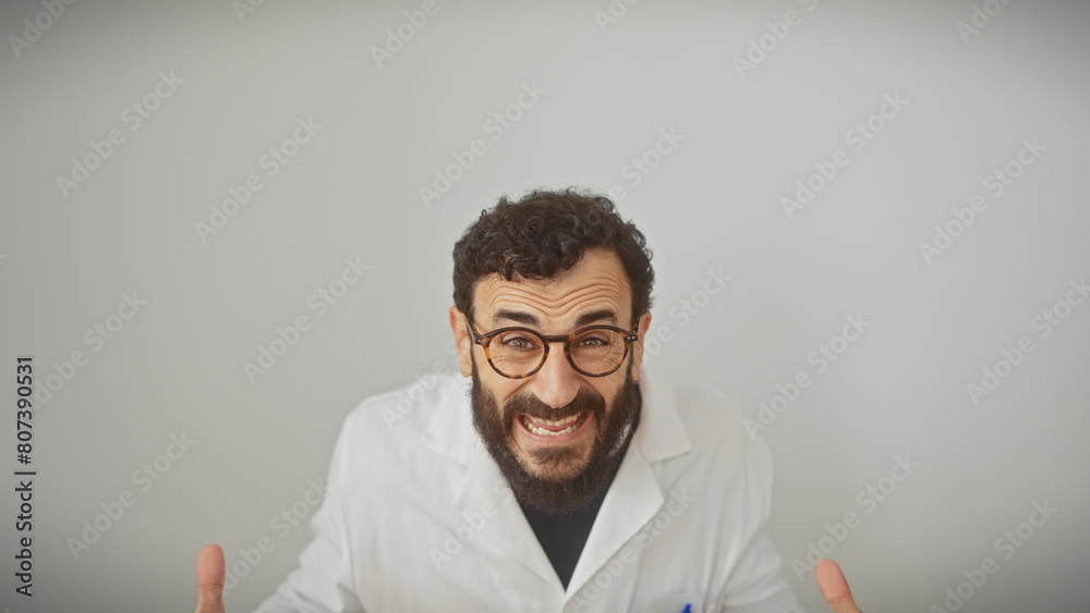 Middle-aged man with beard in lab coat and glasses gestures animatedly against a white background Middle-aged man with beard in lab coat and glasses gestures animatedly against a white background