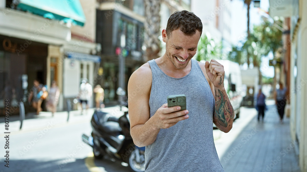 Hispanic man smiling and using smartphone on a sunny urban street, radiating a relaxed and happy vibe. Hispanic man smiling and using smartphone on a sunny urban street, radiating a relaxed and happy vibe.